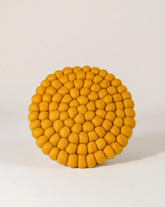 Dessous de plat boule en laine moutarde