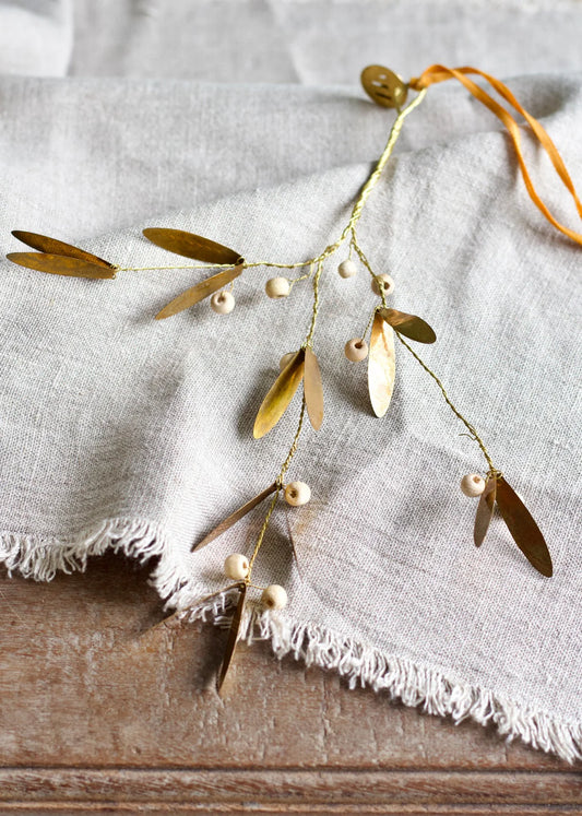 Branche avec perle en bois